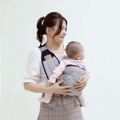 Woman using Clariom Baby Shoulder Carrier with breathable mesh and padded straps for comfort.