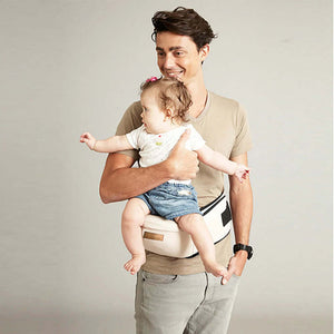 Parent using Clariom ergonomic baby waist carrier with baby in forward-facing position for comfort and support.